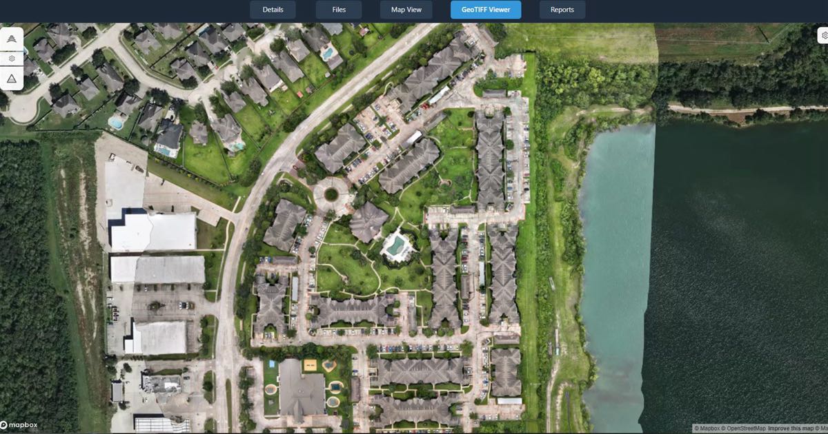 An orthomosaic of a residential site open on the map in a DataDelivery job