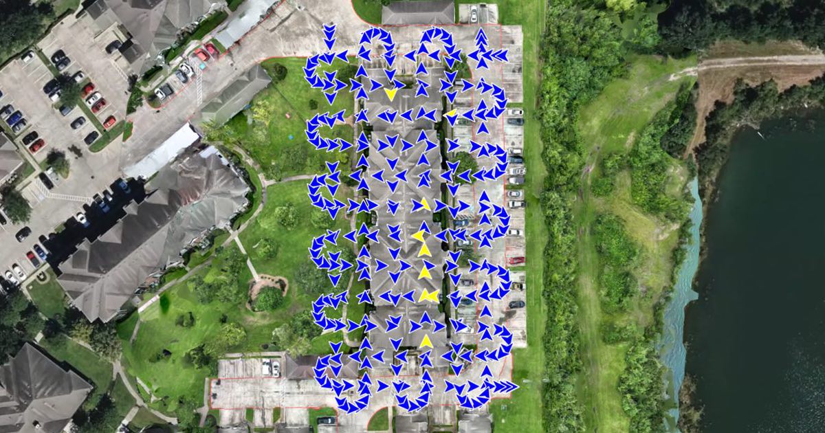An orthomosaic of an apartment complex in DataDelivery Map View, with arrows marking where each drone photo was taken